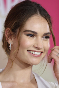 Book Lily James for your next corporate event, function, or private party.