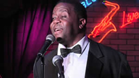 Book Troy Anderson As Louis Armstrong for your next corporate event, function, or private party.